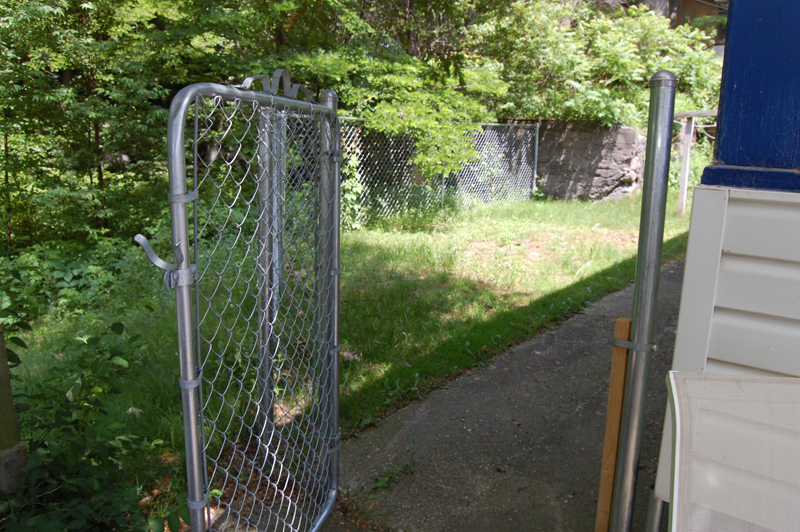 Outdoor gate to fenced in yard of cottage 7. 