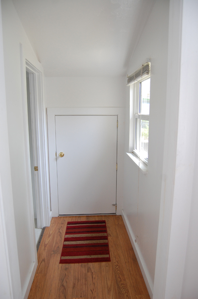Small pet door in hallway of cottage 7. 